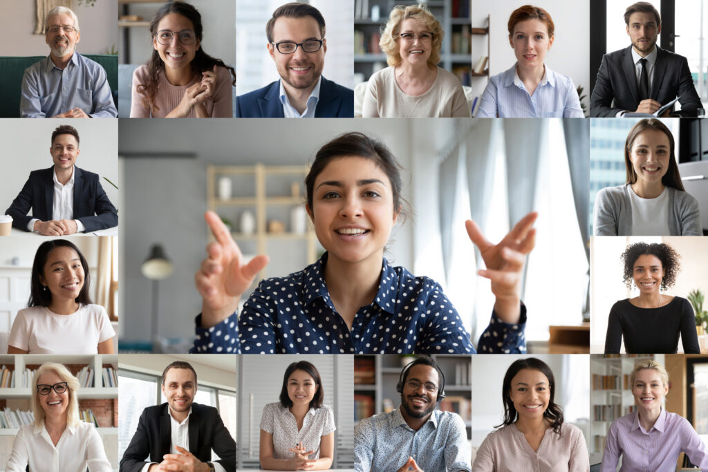 Webcam laptop screen view many faces of diverse people involved in group videoconference on-line meeting lead by indian businesswoman leader, team using video call app work solve common issues concept